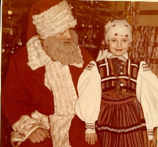 St. Nicholas with a young girl in traditional Polish dress